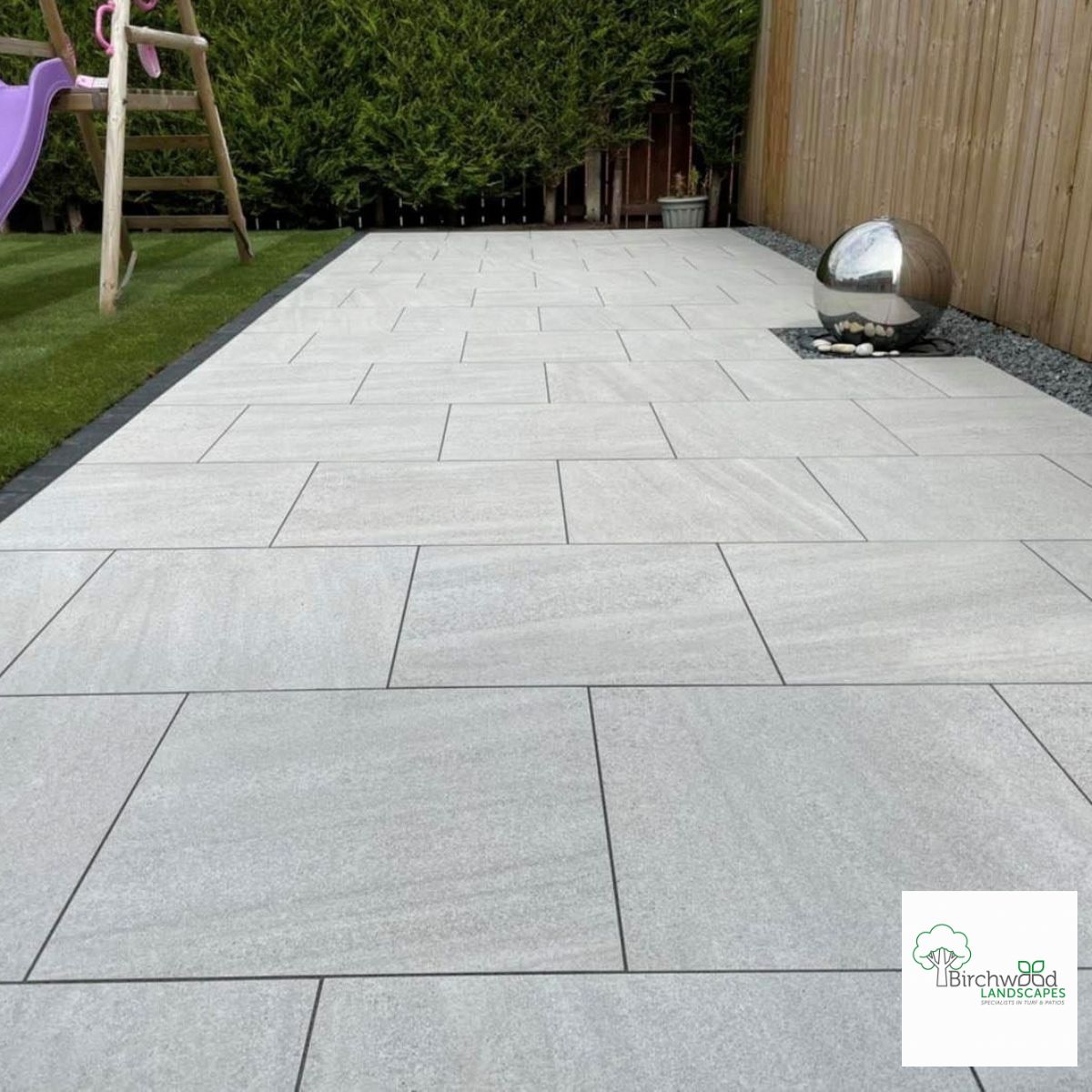 Moonstone White Porcelain Patio Paving with slate coloured grey edging