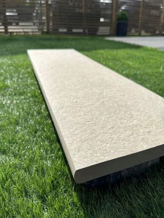 Beige Porcelain bull nose steps on grass