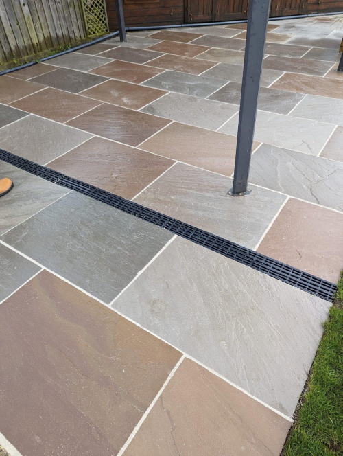 House extension using Raj Green 600x900 riven Indian sandstone patio slabs - Preview