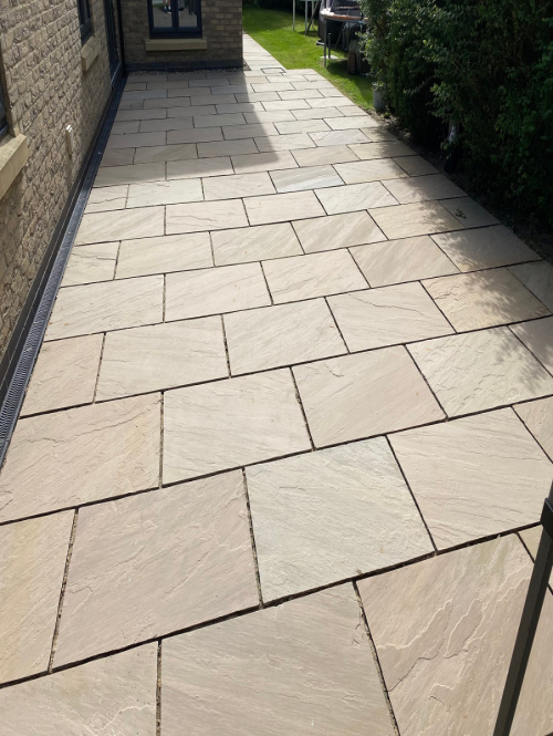 House extension using Raj Green 600x900 riven Indian sandstone patio slabs - Preview
