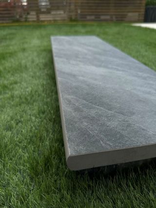 Dark grey porcelain paving with bull nose profile