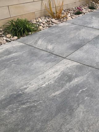 Earth Stone Grey Porcelain 600x900 with decorative aggregates and plants